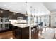 Modern kitchen featuring a large center island, stainless appliances, and pendant lighting at 6143 Eldora St, Golden, CO 80403