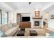 Inviting living room with stone fireplace, built-ins, and neutral decor at 6143 Eldora St, Golden, CO 80403