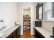 Walk-in pantry with custom shelving and granite countertops at 6143 Eldora St, Golden, CO 80403