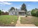 The home includes a spacious backyard with a covered patio, ideal for outdoor entertaining at 1801 S Eudora St, Denver, CO 80222