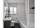Modern bathroom with sleek tile work, a vanity, and shower-tub combination at 1801 S Eudora St, Denver, CO 80222