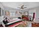 This bright bedroom features a ceiling fan, hardwood floors, and two windows at 1801 S Eudora St, Denver, CO 80222