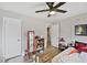 This bedroom features a hardwood floor, closet, and several playful decorations at 1801 S Eudora St, Denver, CO 80222