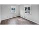 Bright bedroom featuring hardwood floors and a view of the peaceful neighborhood at 1801 S Eudora St, Denver, CO 80222