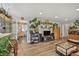 Open living area showcasing hardwood floors, large plant shelves, and seamless flow at 1801 S Eudora St, Denver, CO 80222