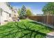 Expansive backyard with lush grass and mature trees, ideal for outdoor activities at 10570 Humboldt Peak Way, Parker, CO 80138