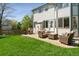 Lush backyard with a patio, grill, and comfortable seating for outdoor enjoyment at 10570 Humboldt Peak Way, Parker, CO 80138
