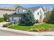 Well-manicured lawn with lush landscaping complements this charming two-story home at 10570 Humboldt Peak Way, Parker, CO 80138