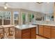 Open kitchen and dining area with modern appliances, center island, and views to backyard at 10570 Humboldt Peak Way, Parker, CO 80138