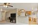 Open concept living room flowing into kitchen with stainless steel appliances at 10570 Humboldt Peak Way, Parker, CO 80138