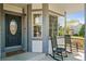Inviting front porch with comfortable rocking chairs and views of the neighborhood at 10570 Humboldt Peak Way, Parker, CO 80138