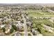 Charming neighborhood aerial view showcases mature trees and proximity to open green spaces at 7060 S Windsor St, Littleton, CO 80128