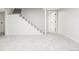 Finished basement with neutral carpet and open layout perfect for a recreational or living space at 7060 S Windsor St, Littleton, CO 80128