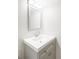 Bathroom vanity features a gray cabinet with chrome hardware and a white sink basin at 7060 S Windsor St, Littleton, CO 80128