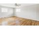 Clean and spacious bedroom featuring hardwood floors and a ceiling fan at 7060 S Windsor St, Littleton, CO 80128