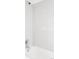 Modern shower with white subway tile and chrome fixtures for a clean, contemporary look at 7060 S Windsor St, Littleton, CO 80128