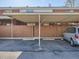 Covered carport with parking space and privacy fencing at 9057 E Oxford Dr, Denver, CO 80237