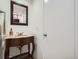 Stylish powder room with decorative vanity and updated fixtures at 9057 E Oxford Dr, Denver, CO 80237