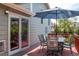 Outdoor back deck with patio furniture, offering a relaxing space for dining and enjoying the backyard view at 10911 Tennyson Ct, Westminster, CO 80031