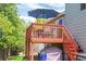 Outdoor back deck with patio furniture, with access to green lawn and storage area, perfect for entertaining at 10911 Tennyson Ct, Westminster, CO 80031