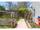 Backyard garden featuring a walkway, raised garden beds, and privacy fence at 10911 Tennyson Ct, Westminster, CO 80031