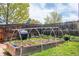 Backyard raised garden bed framed by a modern trellis system, perfect for a variety of plants and vegetables at 10911 Tennyson Ct, Westminster, CO 80031