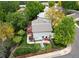 Aerial view of the backyard featuring a well-kept lawn, a deck with outdoor seating, and mature trees at 10911 Tennyson Ct, Westminster, CO 80031