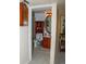 Cozy bathroom with classic wooden cabinet, stand-up shower, and a framed, oval mirror, offering a functional space at 10911 Tennyson Ct, Westminster, CO 80031
