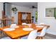 Dining room featuring a spacious wooden table set for six, complemented by a rustic hutch and leafy decor at 10911 Tennyson Ct, Westminster, CO 80031