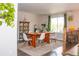 Dining room with a large wooden table, modern chairs, and natural light, perfect for Gathering gatherings at 10911 Tennyson Ct, Westminster, CO 80031