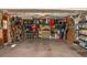 Spacious garage with ample storage, workbench, and well-organized shelving system at 10911 Tennyson Ct, Westminster, CO 80031