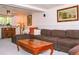 Cozy living room with comfortable seating, a wooden coffee table, and warm lighting at 10911 Tennyson Ct, Westminster, CO 80031