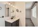 Cozy bathroom with vanity, modern fixtures, and neutral wall coloring at 2221 S Arbutus Ct, Lakewood, CO 80228