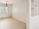 Dining room features bright natural light, tile floors, and view into the adjacent room at 2221 S Arbutus Ct, Lakewood, CO 80228