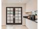 Dining area with elegant French doors providing natural light and style at 2221 S Arbutus Ct, Lakewood, CO 80228