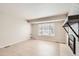 Living room showcasing fireplace, light tile flooring and large window that provides ample natural light at 2221 S Arbutus Ct, Lakewood, CO 80228