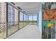 Large balcony with open air and scenic city views through the railing at 7877 E Mississippi Ave # 607, Denver, CO 80247
