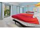 Bright bedroom featuring sliding glass doors, spacious closet, and serene blue walls at 7877 E Mississippi Ave # 607, Denver, CO 80247