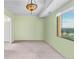 A bright, empty bedroom featuring large windows and a ceiling fan at 7877 E Mississippi Ave # 607, Denver, CO 80247