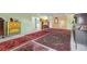 Expansive living area showcasing a collection of antique furniture and decorative Persian rugs at 7877 E Mississippi Ave # 607, Denver, CO 80247