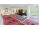 Expansive living area showcasing a collection of antique furniture and decorative Persian rugs at 7877 E Mississippi Ave # 607, Denver, CO 80247