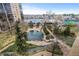 Aerial view of a serene pond and landscaped grounds with walking paths and gardens at 7877 E Mississippi Ave # 607, Denver, CO 80247