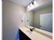 Bathroom featuring a vanity with light countertop and large mirror at 9477 Market Ln, Parker, CO 80134