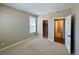 Cozy bedroom with carpet, closet, and a door to another room at 9477 Market Ln, Parker, CO 80134
