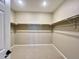Walk-in closet with installed racks and rods that offer a seamless storage solution for optimal organization at 9477 Market Ln, Parker, CO 80134