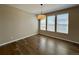 Dining room area with hardwood floors and natural light from three windows at 9477 Market Ln, Parker, CO 80134
