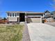 Charming single Gathering home with stone accents, well-maintained lawn and a two-car garage at 9477 Market Ln, Parker, CO 80134