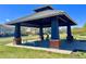 View of the gazebo with picnic benches, perfect for Gathering gatherings and outdoor relaxation at 9477 Market Ln, Parker, CO 80134