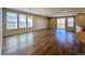 Spacious living room with hardwood floors and natural light from windows at 9477 Market Ln, Parker, CO 80134