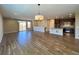 Spacious living room with hardwood floors and open layout to the kitchen at 9477 Market Ln, Parker, CO 80134